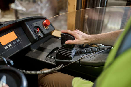 Stock house loader driving the lift truck