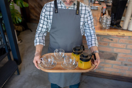 Bartender serving citrus drinks at a bar