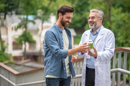 Male patient talking to the therapist regarding new emdicine