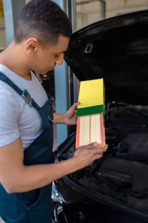 Experienced car mechanic working in an automobile repair shopの写真素材