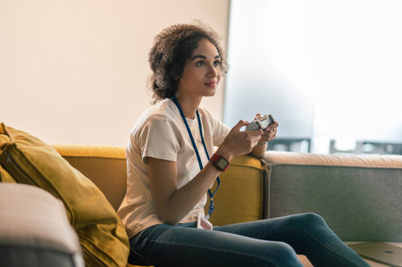 Young woman looking involved while playing play station