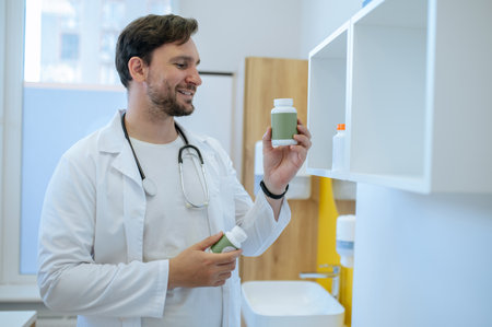 Healthcare professional checking the expiration date of dietary supplementsの写真素材