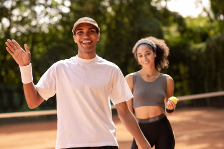 Two tennis players having a workout togetherの写真素材