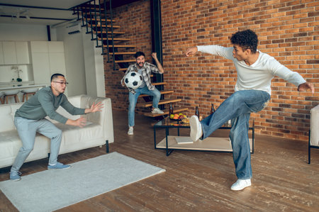 Guys involved in an indoor sports gameの写真素材