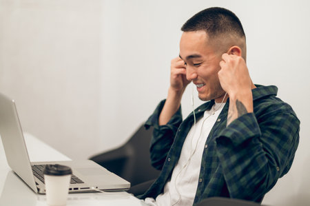 Cheerful company employee preparing to work on the laptop