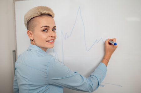 Joyous businesswoman posing for the camera during the presentation