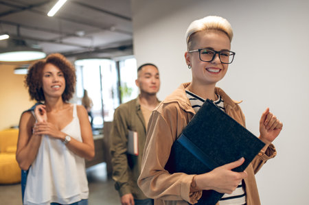 Team of company employees in the office corridorの写真素材