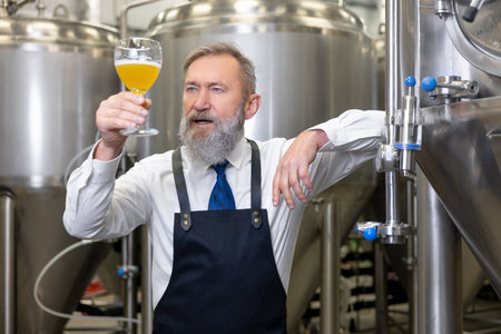 Brewery technologist examining the color of a fresh beverage