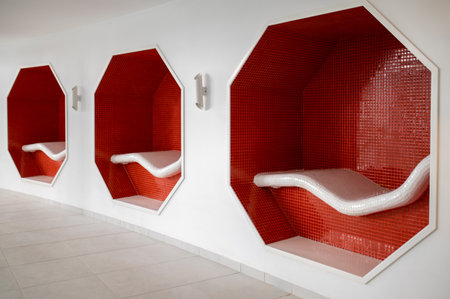 Close up of red benches in the wallの写真素材