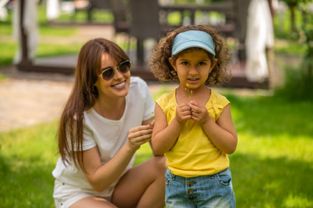 Cute family enjoying good weather in a park
