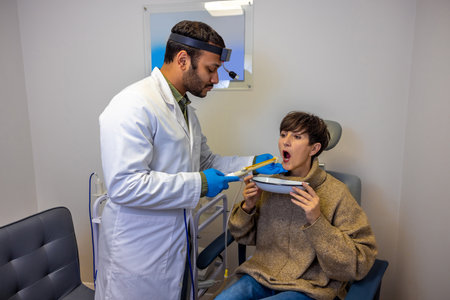 Senior woman having larynx checkup at ent doctor
