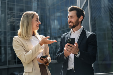Elegant man and woman discusiing somethingの写真素材