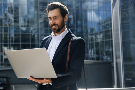Stylish businessman with a laptopの写真素材