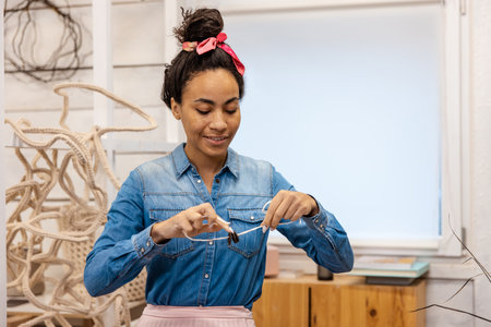 Young woman presenting a course of macrame online