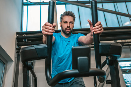 Sportsman having a workout in a gym and looking motivated