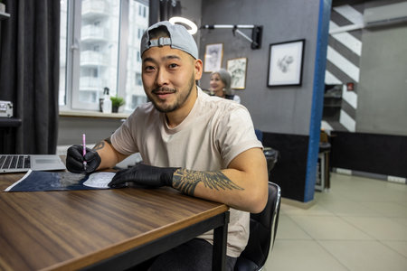 Tattoo master working with skretch in tattoo salonの写真素材