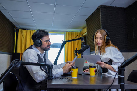 Radio dj talking to a guest in a radio studio