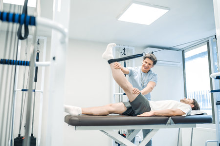 Physal therapist working with patients limb hyperextensionの写真素材