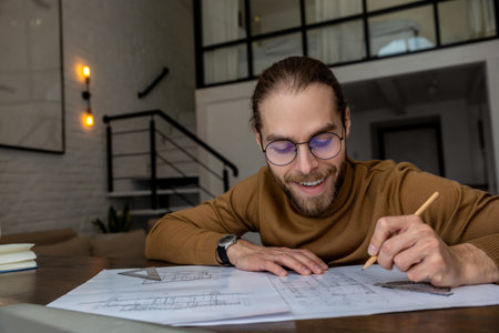 Architect engineer working on blueprints at the office, creatiing new house design, working planningの写真素材