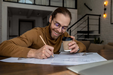 Architect engineer working on blueprints at the office, creatiing new house design, working planningの写真素材