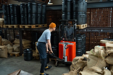 Hipster man roasting factory worker preparing coffee beans for coffee brewing.の写真素材