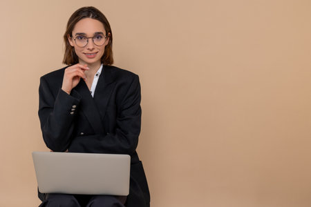 Young woman in elegant suit looking thoughtfulの写真素材