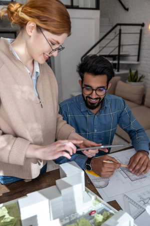 Two people working together on the project in the home officeの写真素材