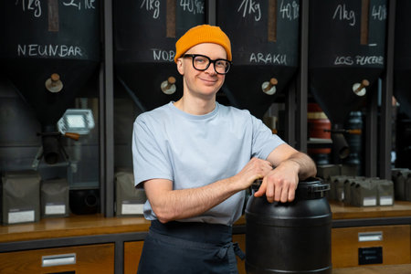 Cafe barista making coffee preparation service standing with plastic barrel at counter..