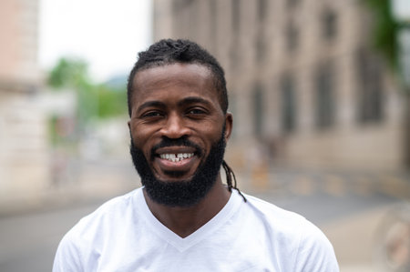 Portrait picture of a smiling dark-skinned handsome manの写真素材