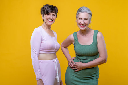 Two good-looking senior women feeling excitedの写真素材