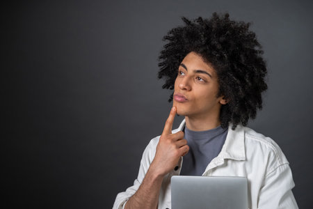 Young freelancer looking thoughtful and focusedの写真素材