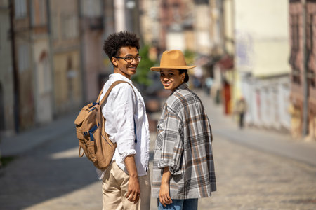 Cute couple having a walk and feeling wonderful togetherの写真素材