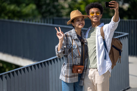 Young cute couple of tourists making selfie and smilingの写真素材