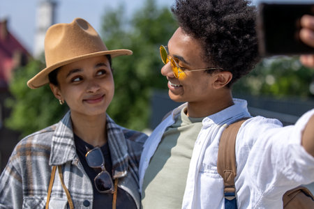 Young cute couple of tourists making selfie and smilingの写真素材