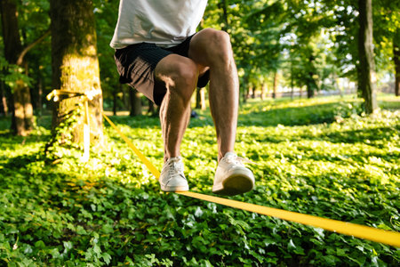 Close up picture of a man balancing on the rope