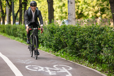 Young manager commuting to work on electric scooter