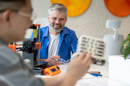 Architects making house model working with 3D printer, creating process.の写真素材