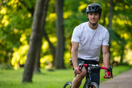 Well-built young cyclist on a bike looking confidentの写真素材