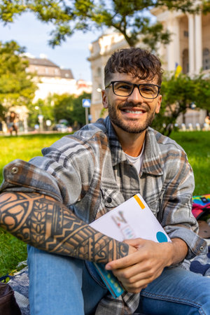 Young man preparing for the exam and looking excitingの写真素材