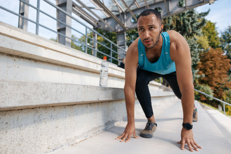 Young well-built man having a workout and looking determined
