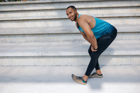 Man on the stairs doing stretching