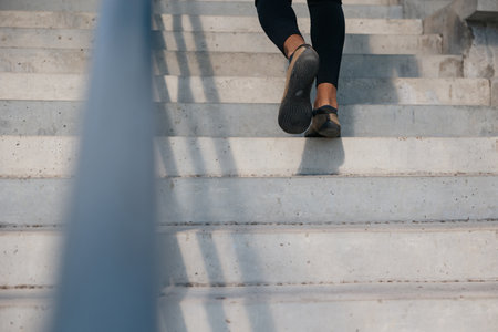Close up picture of mans legs on the stairs