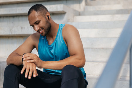 Young man in sportswear on the stairs after a good workout