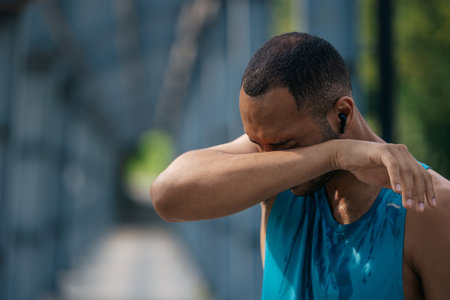 African american sportsman feeling tired exhausted after workoutの写真素材
