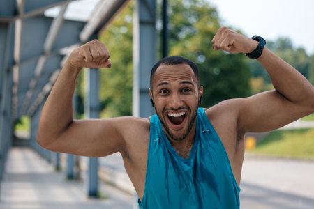 Handsome young african american sportsman feeling excitedの写真素材