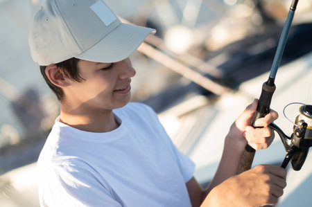 Dad and son spending time together on the yacht and fisihingの写真素材
