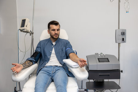 Man preparing for insertion of drip in clinic.の写真素材