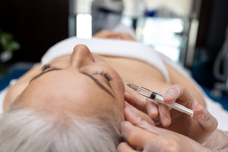 Female patient having anti age treatment at cosmetologistの写真素材