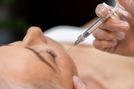 Mature woman receiving anti age teatment at beauty clinicの写真素材