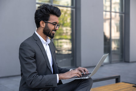 Close up of a businessman working on laptop